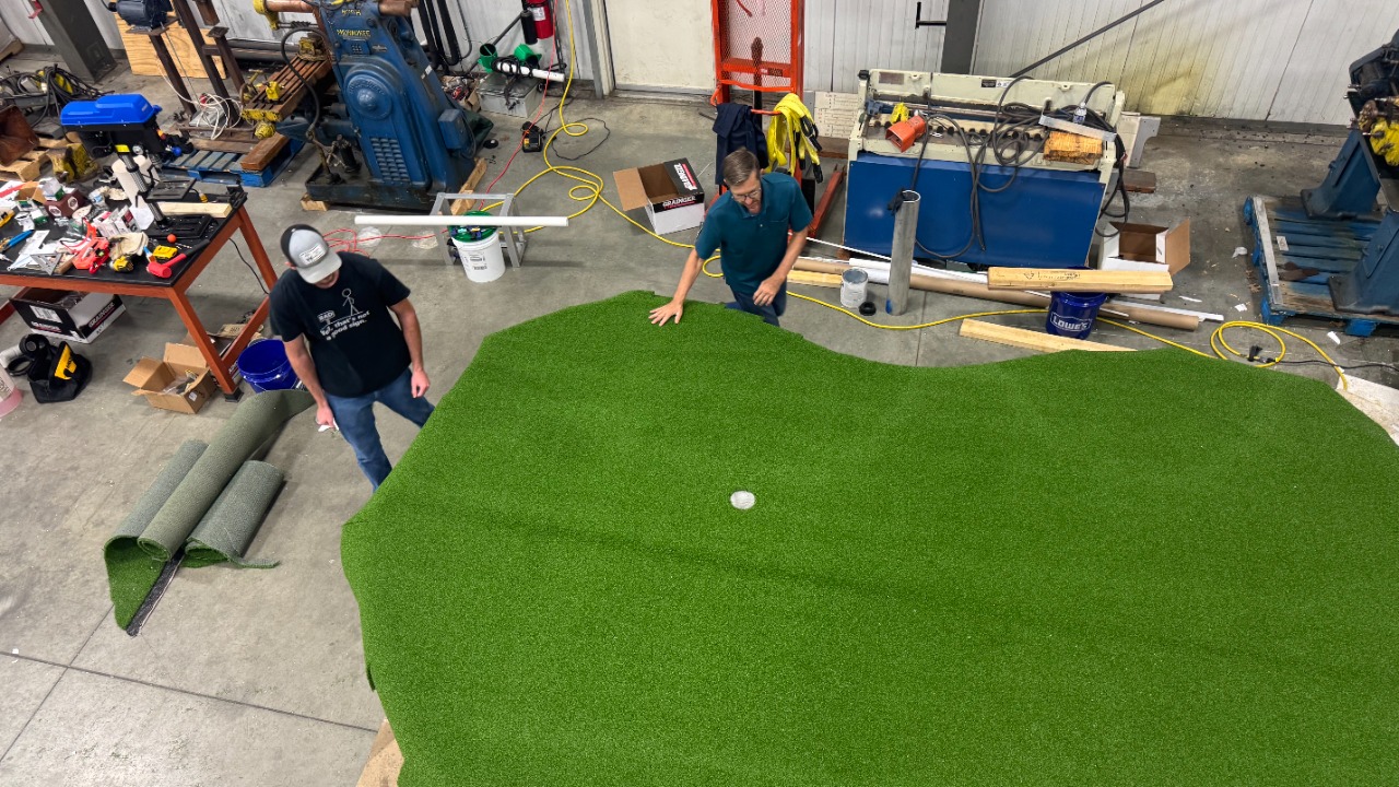 Construction of a floating chipping green.