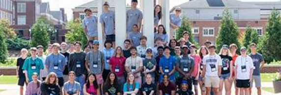 Students standing under Cupola