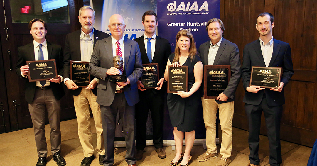 Aerospace engineering students and alumni recognized at the AIAA Greater Huntsville Section’s annual awards banquet pose with their awards. From left are Cade May, Chris Crumbly, Mark Miller, Thomas Teasley, Melissa McDaniel, Tim Keeter and Griffin DiMaggio.