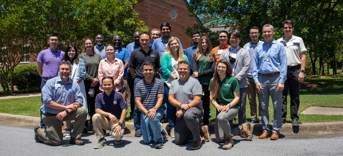 Professor training course group photo outside NCAT main facility