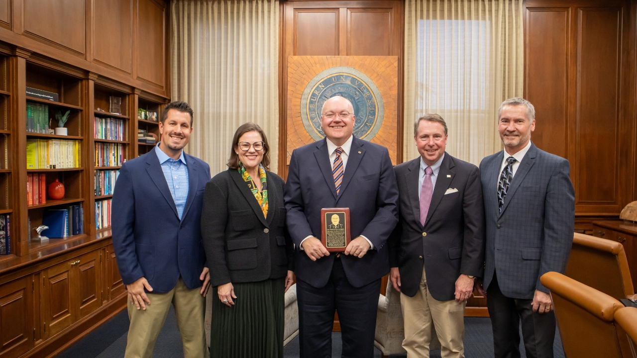 Auburn University President Christopher Roberts presented with a commemorative plaque for his induction onto the NCAT Wall of Honor. From left to right, Brian Enders, Audrey Copeland, Chris Roberts, Jay Winford, Randy West.